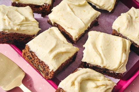 Tomato Soup Spice Cake sliced and shown on a baking sheet. - select to zoom