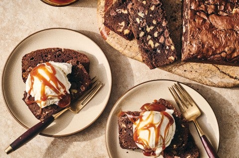 A sliced Brownie Loaf on a plate with vanilla ice cream and a caramel swirl - select to zoom