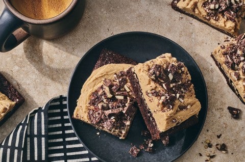 Chocolate Caramel Almond Crunch Brownies on a beautiful table setting seen from above. - select to zoom