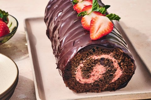 Chocolate Strawberry Roll Cake on a sheet pan - select to zoom