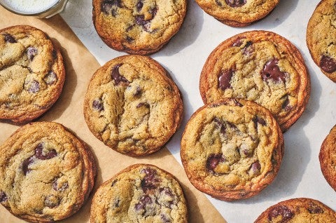 Classic Chocolate Chip Cookies spread on a white counter. - select to zoom