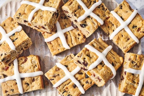 Gluten Free Hot Cross Biscuits arranged on a countertop - select to zoom