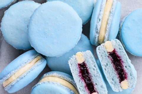 Pile of macarons with one split in half