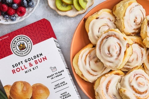 Cinnamon Rolls on a plate with a box of Roll & Bun King Arthur Baking mix - select to zoom