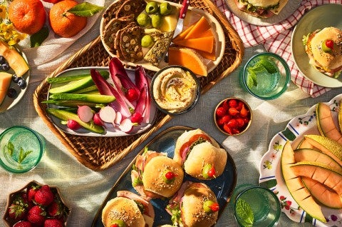 Hot Party Sandwiches on an elaborate table with other vegetables, dips, and lunch items - select to zoom