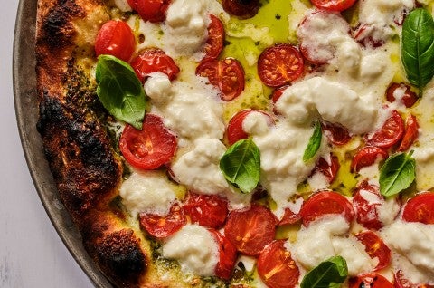 Overhead view of fresh baked caprese style NY pizza