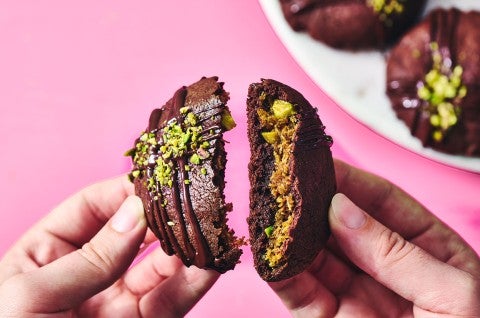 Breaking a Dubai Chocolate Cookie in half to show the filling - select to zoom