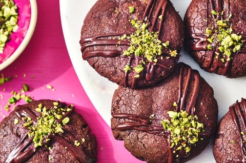 Dubai Chocolate Cookies on a plate and a pink counter - select to zoom