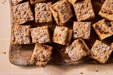 Apple Crumb Cake sliced up and arranged on a cutting board - select to zoom