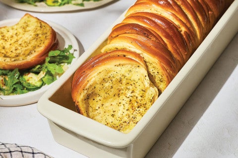 Butterflake Herb Loaf in a pan showing the buttery and herbaceous interior - select to zoom