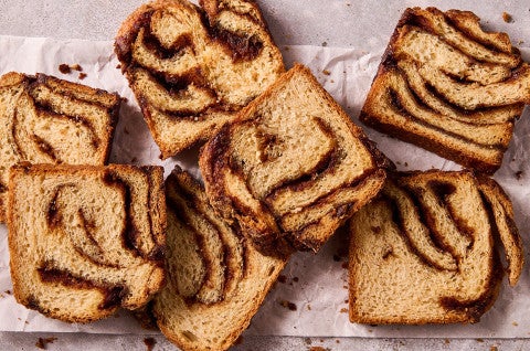 Cinnamon Babka slices arranged on a counter with thick swirls of cinnamon - select to zoom