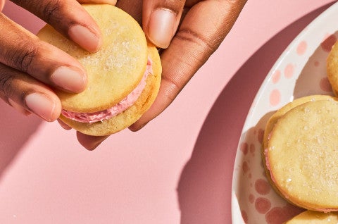 A person holding a Strawberry Shortcake Cookie - select to zoom