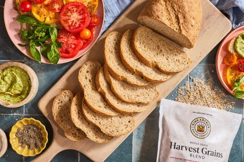 Slices of Seeded Multigrain Sourdough Bread on a cutting board - select to zoom