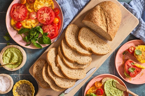 Slices of Seeded Multigrain Sourdough Bread on a cutting board - select to zoom