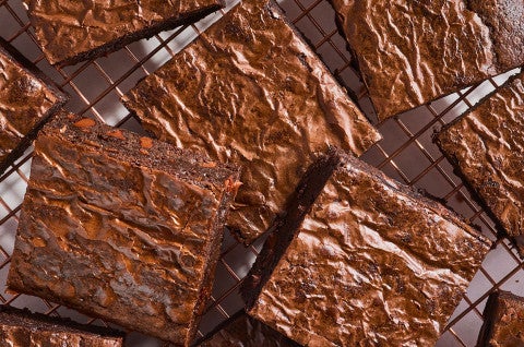 Fudge Brownies arranged on a cooling rack seen from above. - select to zoom