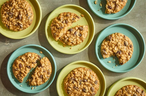 The Softest Oatmeal Raisin Cookies arranged on colorful plates seen from above - select to zoom