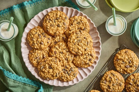 A pile of The Softest Oatmeal Raisin Cookies on a plate seen from above. - select to zoom