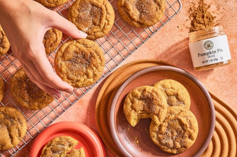 Placing a Pumpkin Snickerdoodle Cookie onto a plate - select to zoom