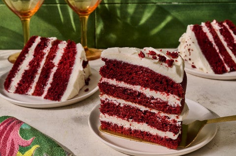 Slices of layered Red Velvet Cake on plates - select to zoom