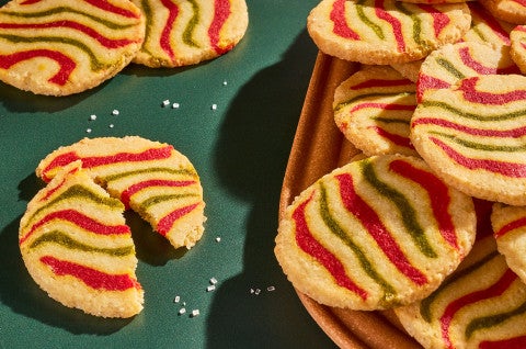 Ribboned Peppermint Shortbread Cookies on a green surface - select to zoom