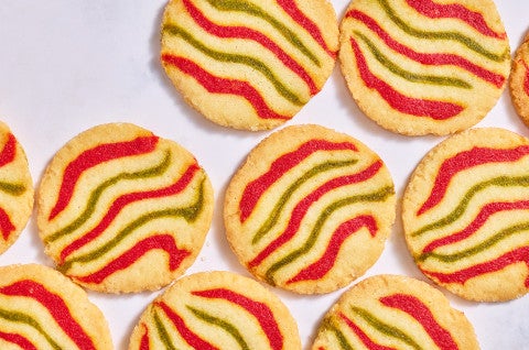 Ribboned Peppermint Shortbread Cookies on a white counter - select to zoom