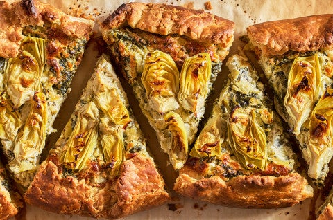 Spinach Artichoke Galette sliced and arranged on a counter, seen from above - select to zoom