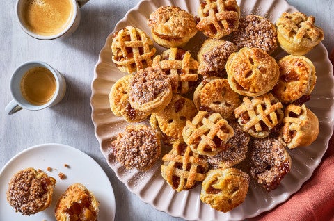 Lots of Mini Apple Pies arranged on a plate - select to zoom