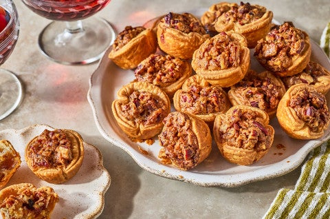Pecan Tassies arranged on a plate - select to zoom