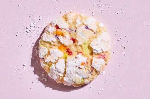 A Sprinkle Crinkle Cookie on a light lavender background - select to zoom