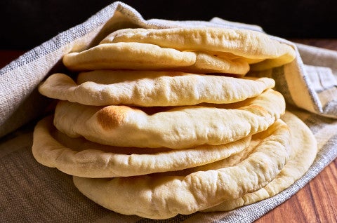 A stack of Golden Pita Bread on a counter