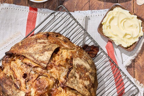 Sourdough Apple Cinnamon Hearth Bread on a cooling rack seen from above - select to zoom