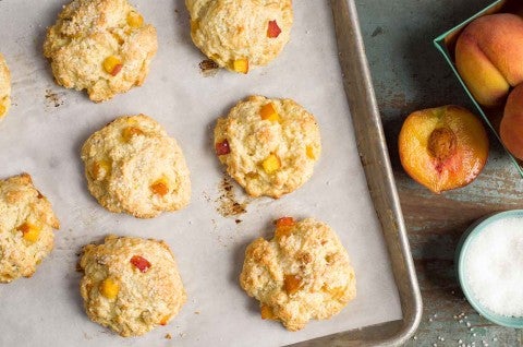 Tender Peach Scones on a baking sheet, fresh from the oven