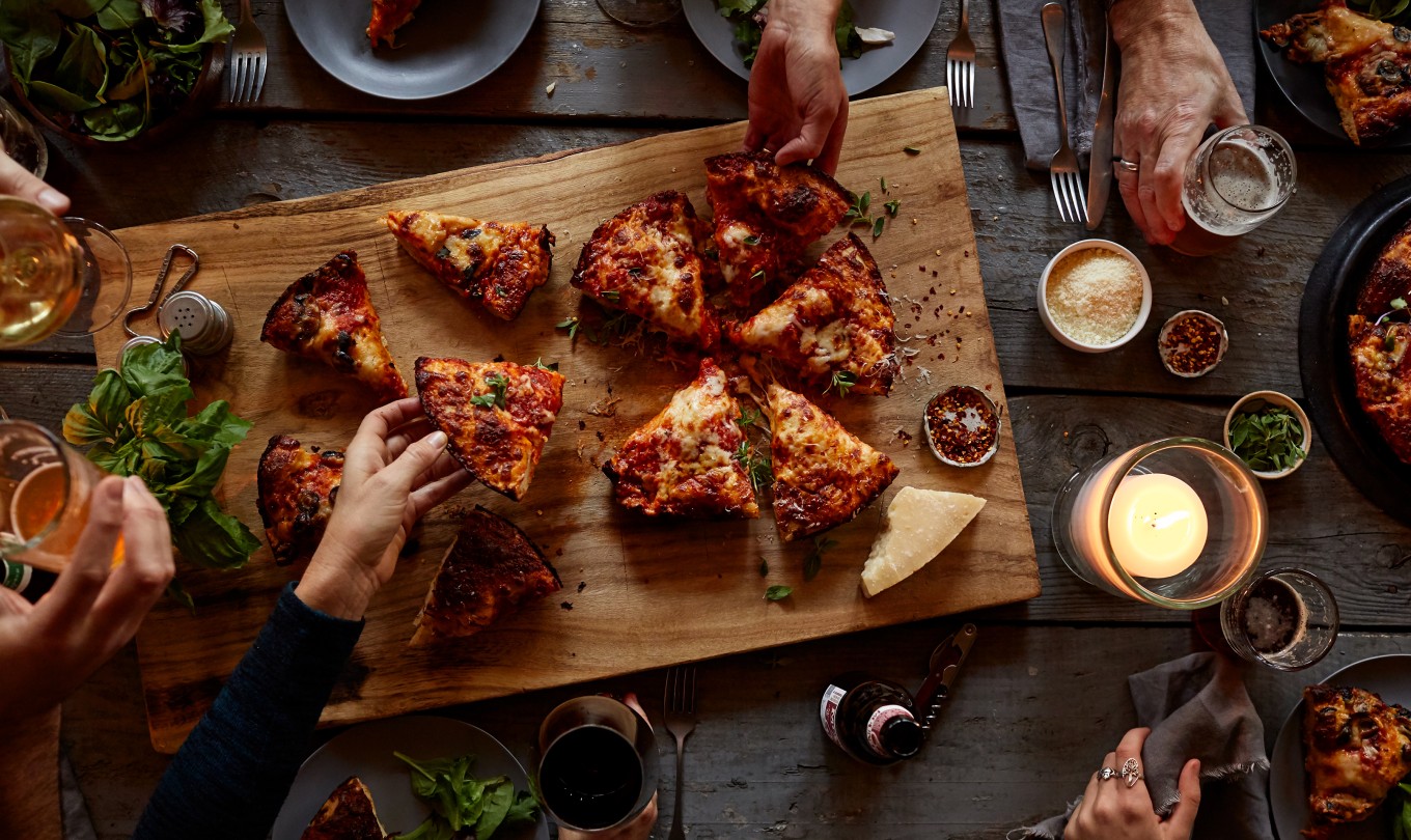 pizza on a table with drinks