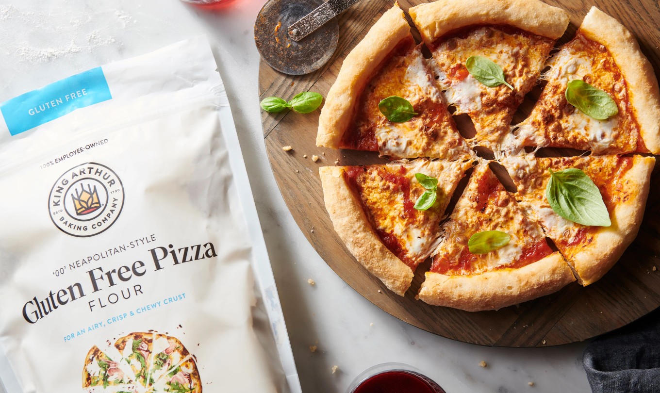 Gluten-free pizza next to a bag of King Arthur Gluten-Free Pizza Flour