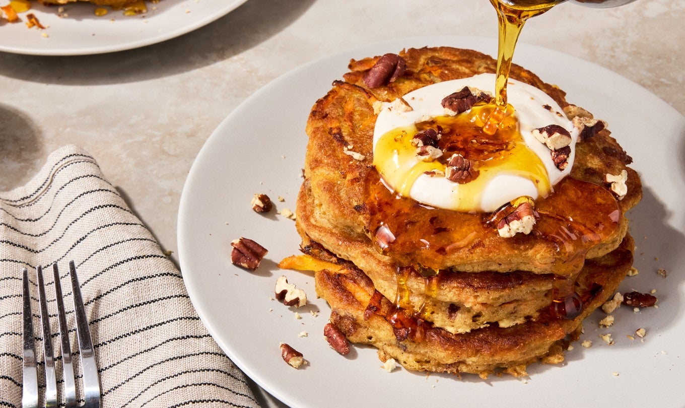 Carrot Cake Pancakes on a plate with maple syrup