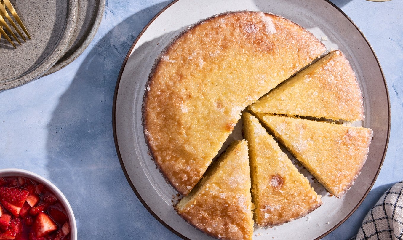 Lemon Ricotta Cake sliced on a plate