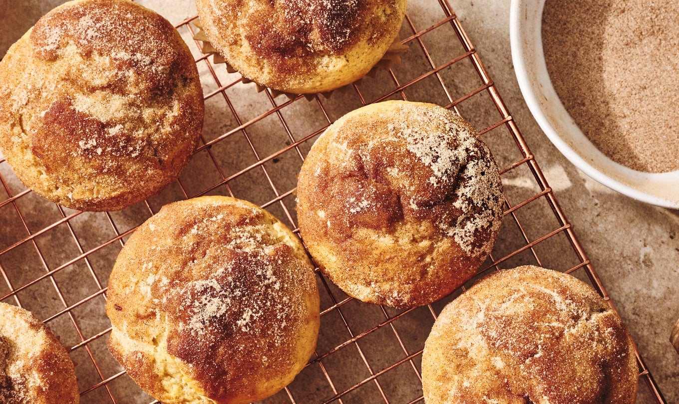 Cinnamon-Sugar Doughnut Muffins on a cooling rack