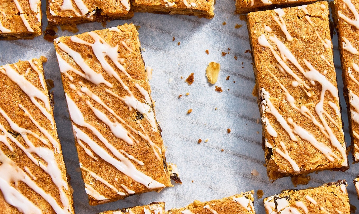 Oatmeal Raisin Cookie Bars sliced up on parchment paper