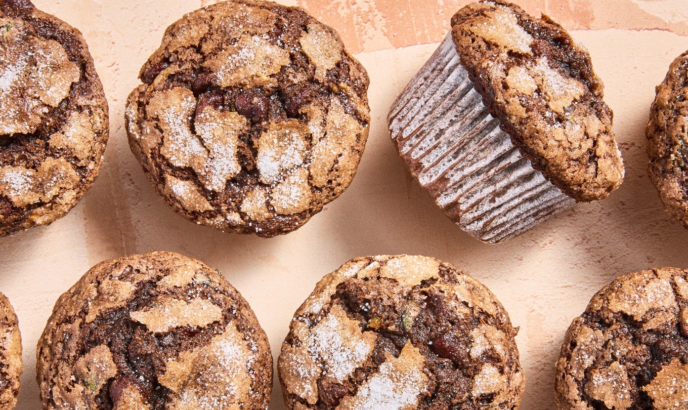 Chocolate Zucchini Muffins laid out on a counter