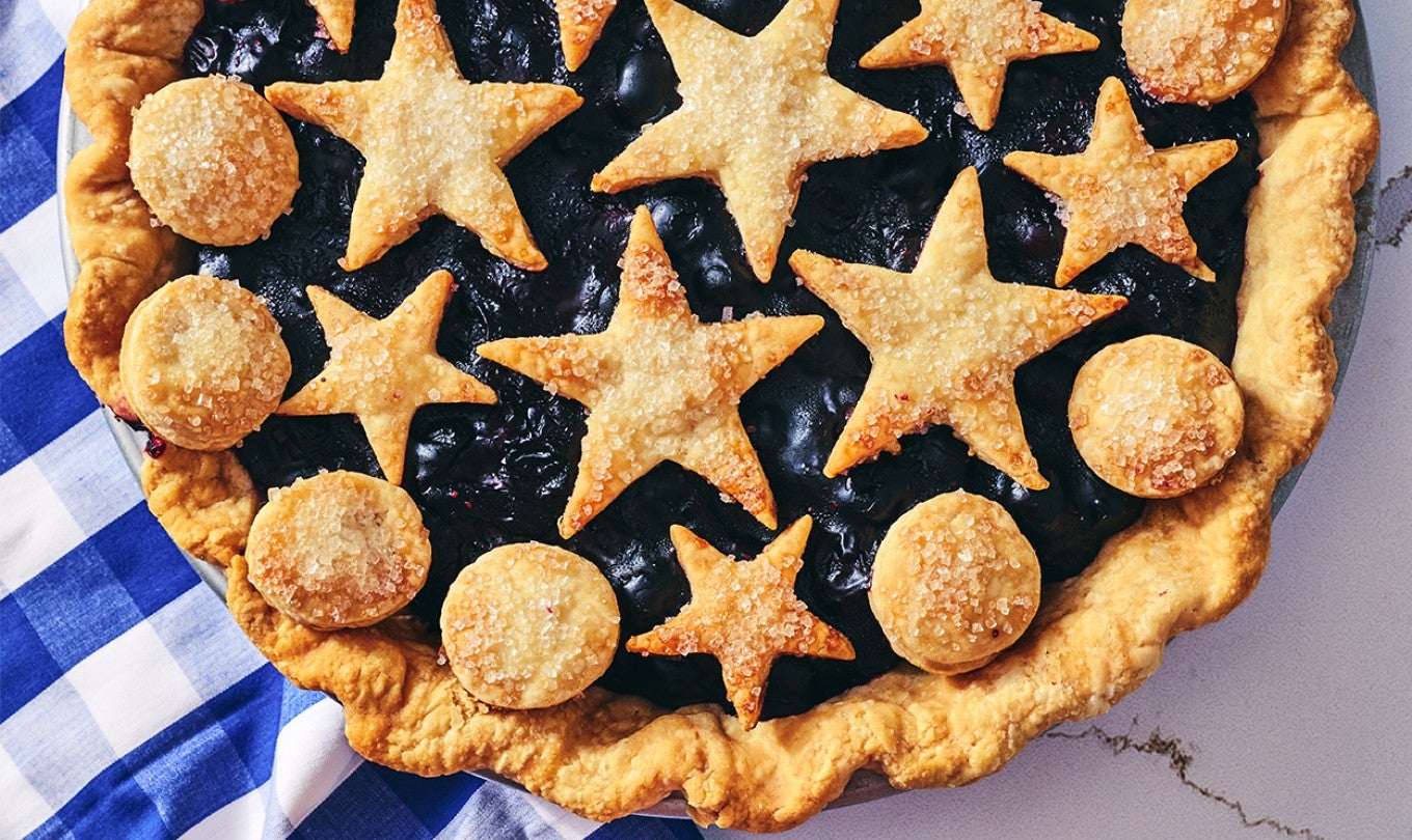 Fresh Blueberry Pie in a pan; shot from overhead