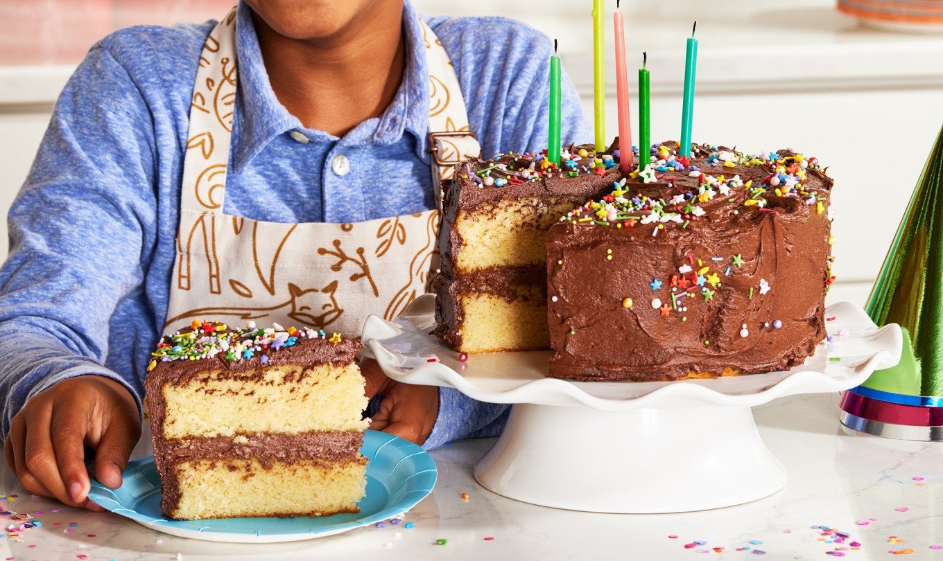 A little boy with a birthday cake