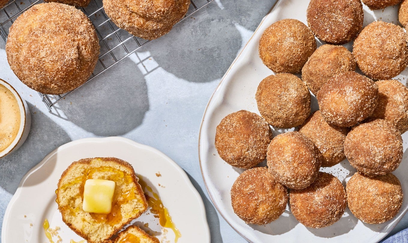 Maple French Toast Mini Muffins arranged on plates on a counter.