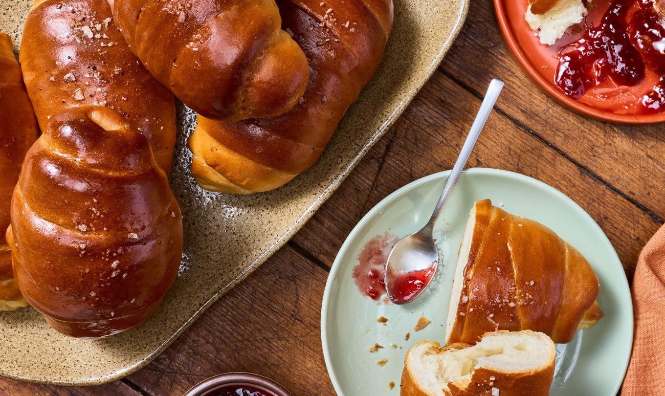 Salt Bread arranged on a table with jelly.