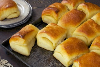 A tray of buttery, freshly baked Parker House Rolls