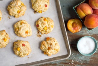 Peach scones on a baking sheet, fresh from the oven.