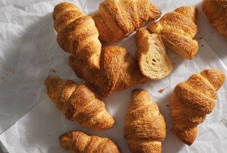 Multiple freshly baked croissants 