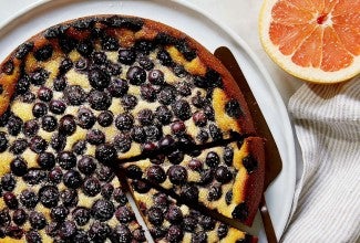 Plate with sliced blueberry breakfast cake