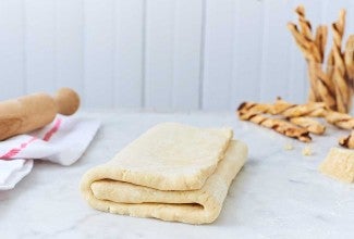 Folded puff pastry dough on the counter