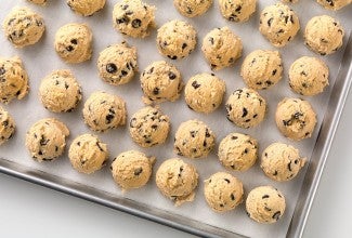 A tray of cookie dough about to go into the freezer