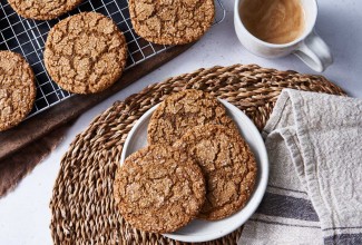 Spiced rye ginger cookies on plate and cooling rack